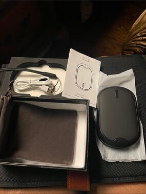 10000 mAh Rechargeable Hand Warmer/Power Bank-Black. New in box. Works 7-15 hrs.